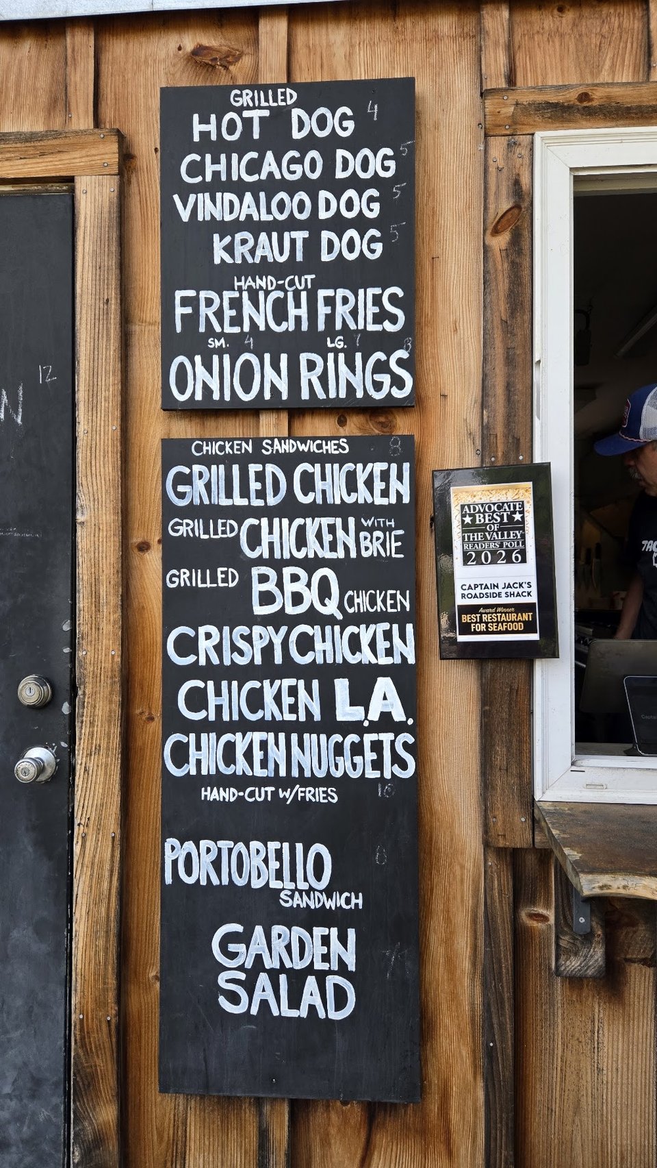 Menu featuring fish and chips and clam plates.
